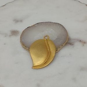 Large bright gold matte leaf shaped pendant
